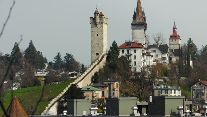 Historic Musegg Wall (Museggmauer) and its medieval towers overlooking the city of Lucerne.