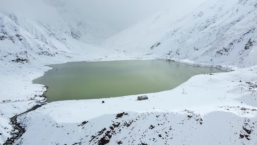 Winter Landscape With Snow Covered Hills and lake