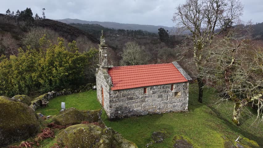 Stone cruceiros on a rural galician landscape