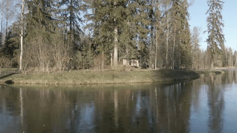 Drone Circling Pond Forest Lodge Buildings