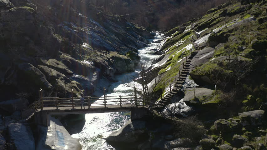 Aerial view of Los Pilones in Garganta de los Infiernos, Spain. Exceptional river flow surging through granite formations in Jerte Valley, creating powerful whitewater and dramatic flood-like natural landscape.