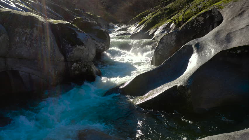 Aerial view of Los Pilones in Garganta de los Infiernos, Spain. Exceptional river flow surging through granite formations in Jerte Valley, creating powerful whitewater and dramatic flood-like natural landscape.