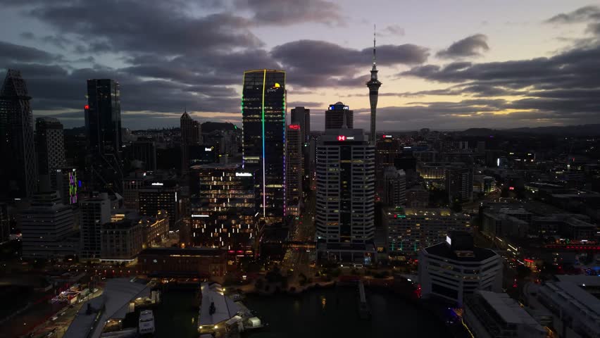 Auckland New Zealand aerial by drone at sunset with city skyline