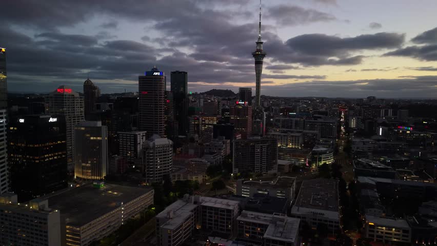 Auckland New Zealand aerial by drone at sunset with city skyline