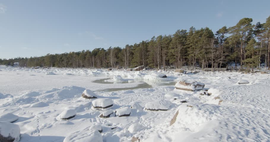 Snowy winter landscape at Varlaxudden recreation area located on the southern tip of Emäsalo island in Porvoo, Finland. 