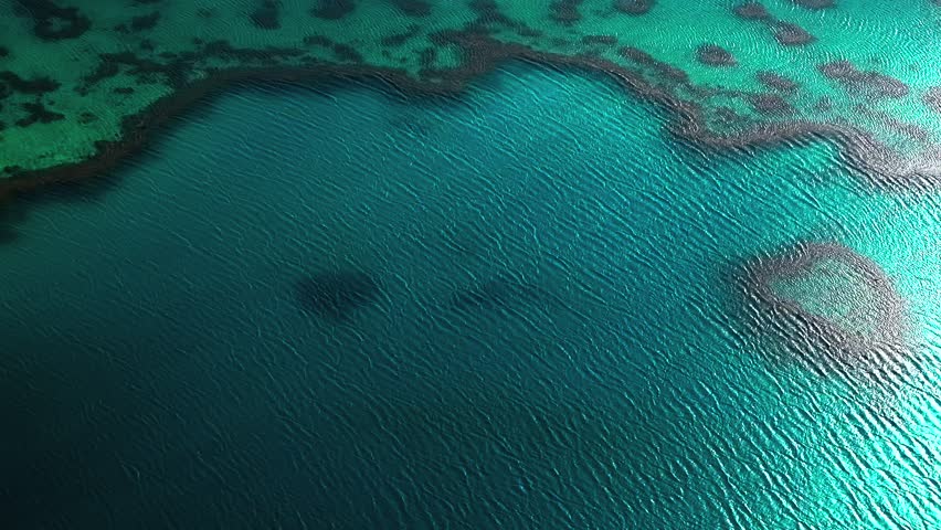 Heart Reef Hardy Outer Great Barrier Reef lagoon Whitsundays scenic flight aerial drone Whitsundays Islands Australia QLD National Park sunny serene coral formation clouds clear blue aqua ocean waters