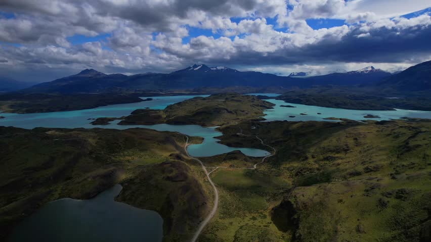 Drone Hyperlapse Over Turquoise Glacial Lakes Under Clouds In Patagonia
