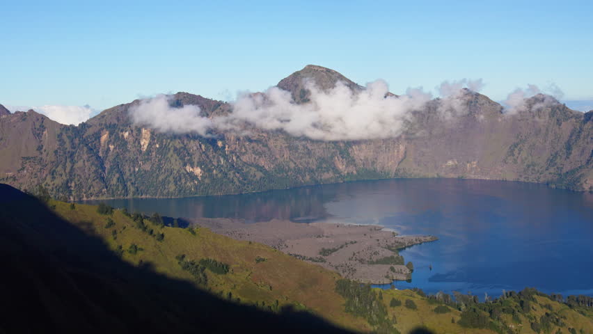 Panning video across the caldera of Mount Rinjani showing Sagara Anak crater lake