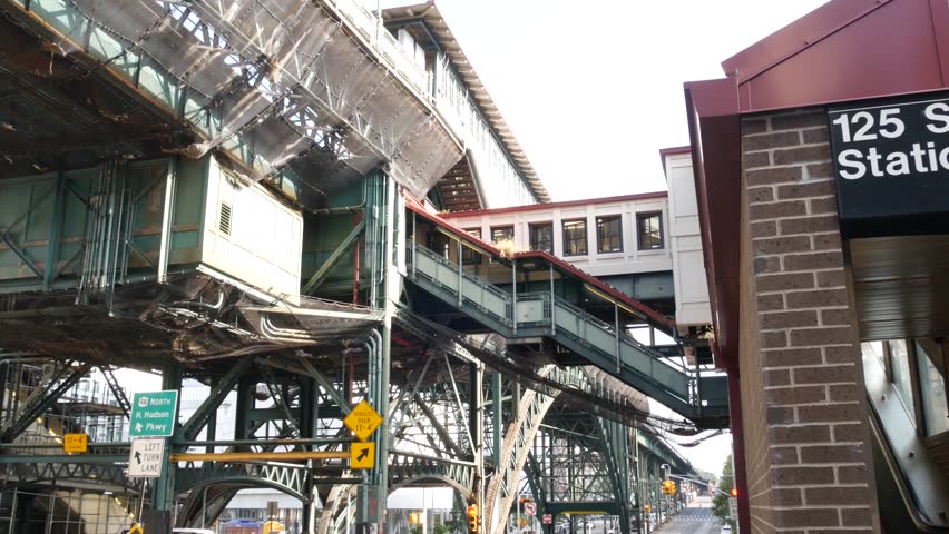 New York City 125 street elevated subway metro entrance in Harlem, United States. American passenger transport, Upper Manhattan. Metropolitan station in NYC USA. Historic architecture, metallic bridge