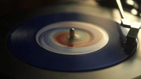 Blue Vinyl Record Spinning on Wintage Turntable With Crystal Needle, Close Up - Powered by Shutterstock - Get 15% off with code: PIKWIZARD15