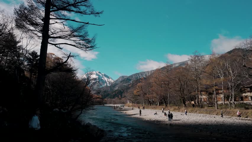 Beautiful landscape of nature autumn foliage at kamikochi, Azusa River and Snow Hotaka Mountains in Japan. 
