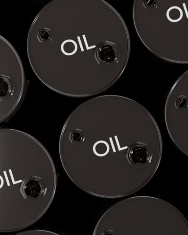 Top view of black oil barrels background