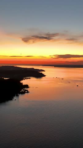 Sunset aerial view at Amazon River of Amazon Rainforest at town of Manaus Amazonas Brazil. Tourism landmark. Nature scenery. Travel destinations. Black River at Amazon Forest Amazonas Brazil.