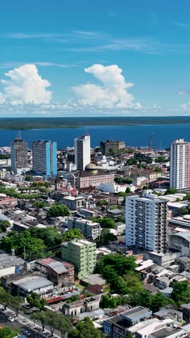 Downtown Manaus Brazil. Capital city of Amazonas State near Amazon river and Amazon forest. Tropical destination. Tropical travel. Tourism landmark. Outdoors urban scenery downtown Manaus Brazil.