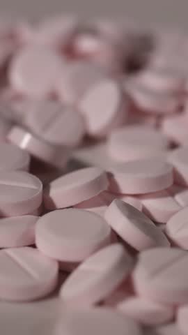 Medical pills. Pink pills. Slow motion video. High quality 4k footage