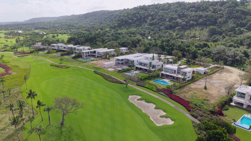 Aerial view of luxury real estate properties and villas under construction integrated with Playa Grande golf course, Dominican Republic