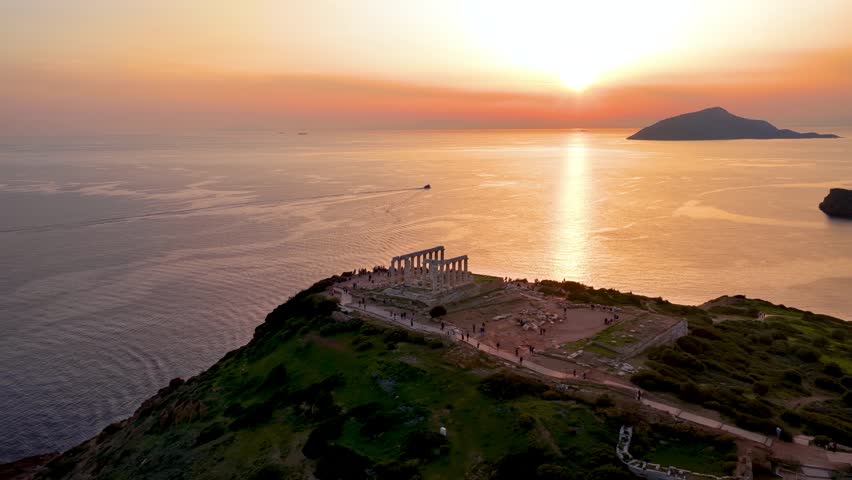 Aerial sunset view of the ancient Temple of Poseidon at Cape Sounion at the edge of Attica, Athens, Greece