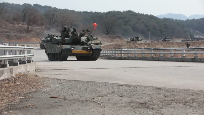 Republic of Korea Army troops are heading to the battlefield with K1A1 tanks.