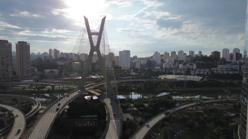Aerial drone view of the Ponte Estaiada Octávio Frias de Oliveira in São Paulo, Brazil. Iconic cable-stayed bridge surrounded by urban buildings, showcasing modern architecture, transportation infrastructure, and the dynamic skyline of one of Latin America’s largest cities.