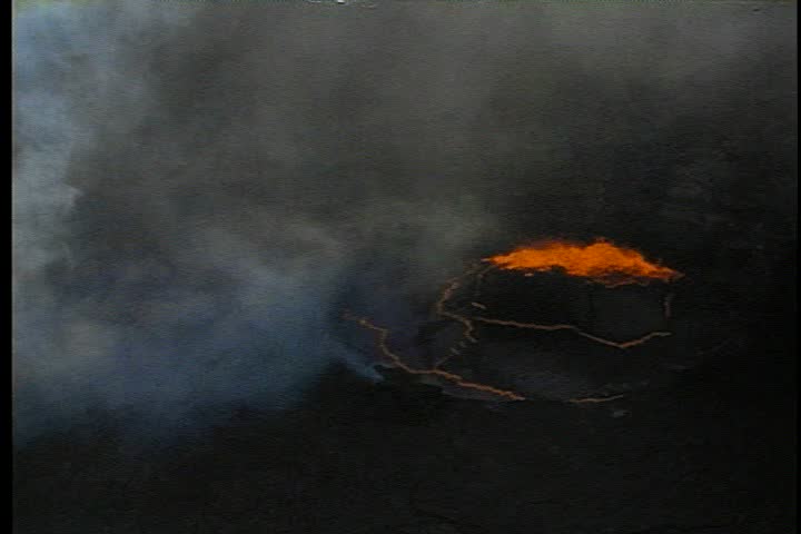 Aerial steamy lava lake covered with a crust of hardenend lava. Molten lava is bubbling up through hole in crust in Kilauea, Hawaii.
