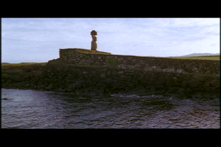 WS single moai statue on sea wall on Easter Island, Chile.