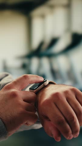 Smart watch using in gym, Close up of woman hands im gym checking incoming notification on smart watch. Incoming text message received on app smartwatch. Social media networking technology concept.
