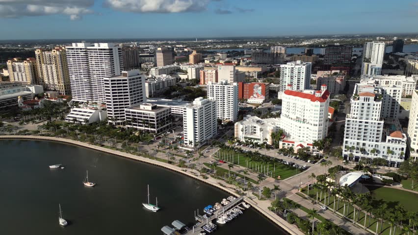 Aerial View of Downtown West Palm Beach Waterfront with Sailboats, Palm Promenade and City Skyline