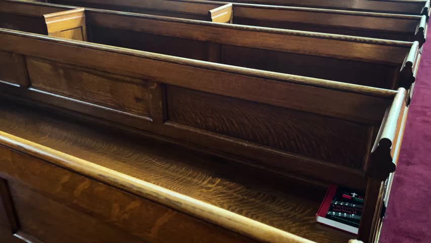 Overhead view of church pews showing rows of wooden seating in the sanctuary