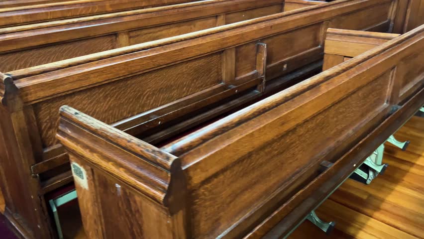 Overhead view of church pews showing rows of wooden seating in the sanctuary