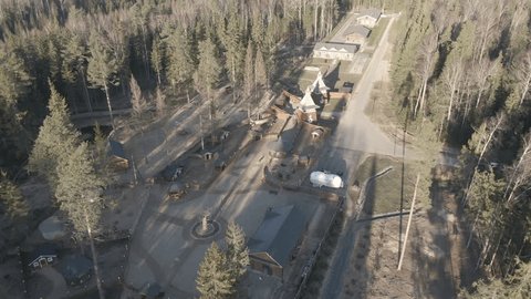 Drone Descending Forward over Wooden Fortress Complex