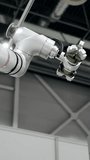 Industrial robotic arm with metal gripper operating in automated manufacturing environment. - Powered by Shutterstock - Get 15% off with code: PIKWIZARD15