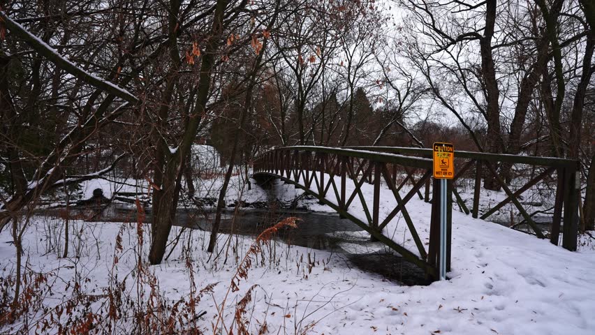 Wooden Bridge Over River at Courtice Florell Drive Park in Winter