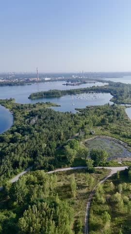 Aerial view of Toronto Tommy Thompson Park Islands and Lake Ontario skyline in clear summer light. g.