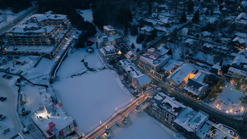 Winter view of Elora bridge, frozen river at dusk, calm and serene scene