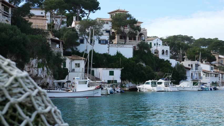 The marina of Cala Figuera with a fishing net in the foreground. Mallorca, Spain.