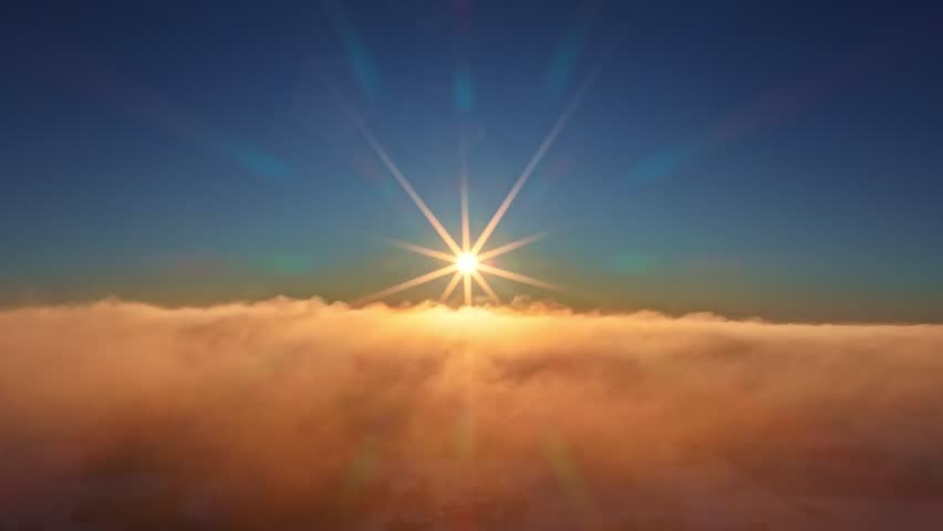 Flying above the clouds with a bright sun. Views of heaven