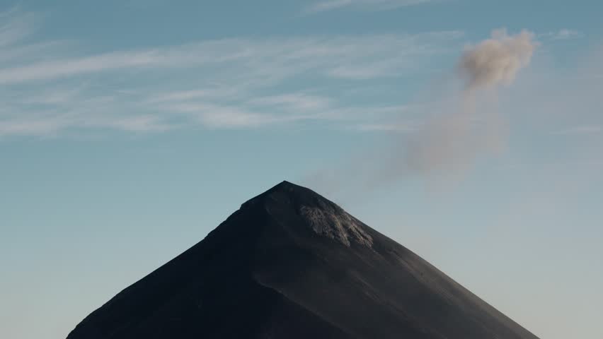 Dark ash plume erupting from summit of Fuego volcano