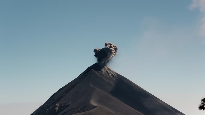 Fuego volcano eruption plume rising from crater in Guatemala