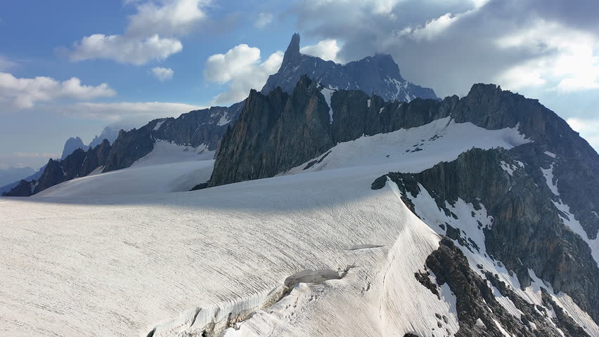 Amazing view to the glaciers of the Mont Blanc range on the Italian side. In the background the Dent du Géant. Wonderful landscape. Summer time