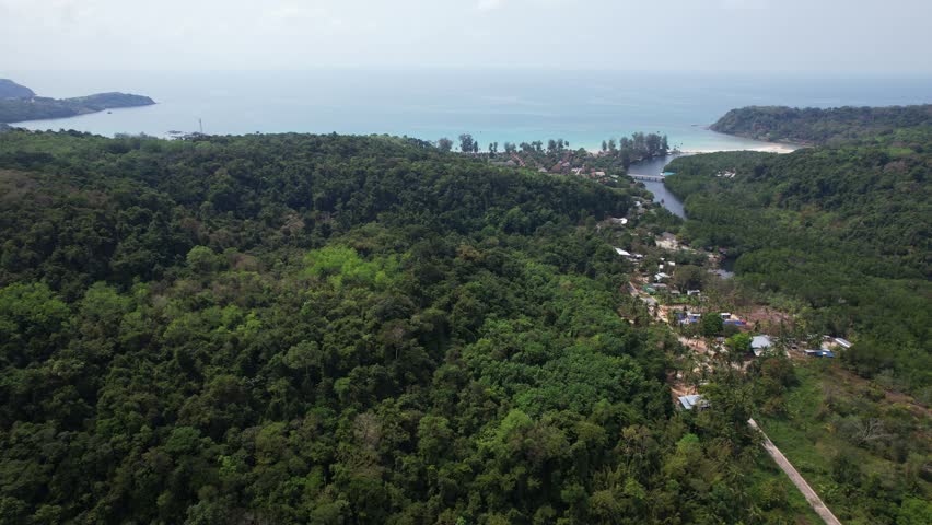 Lush Mangrove Forests And Jungles Overlooking Beachfront Town In Klong Chao Beach On Koh Kood Island In Thailand. Aerial Tilt-up Shot