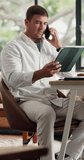 Remote work, phone call and man with tablet for review, client feedback or firewall software project. Talk, explain system plan or person with tech for security program development, freelance or home - Powered by Shutterstock - Get 15% off with code: PIKWIZARD15