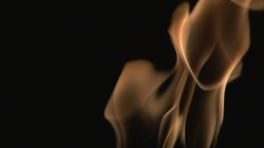 Isolated fire flame burning on black background, close up slow motion.