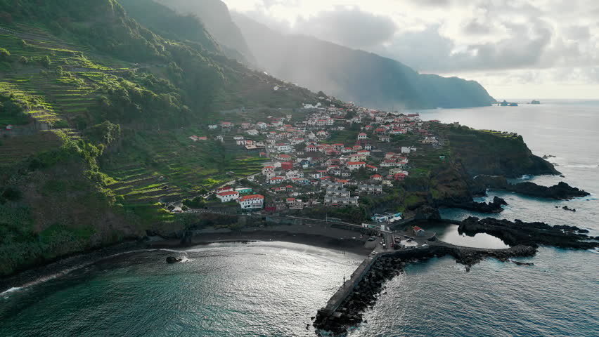 Seixal village on Madeira north coast, Portugal, with Atlantic Ocean waves and rugged cliffs