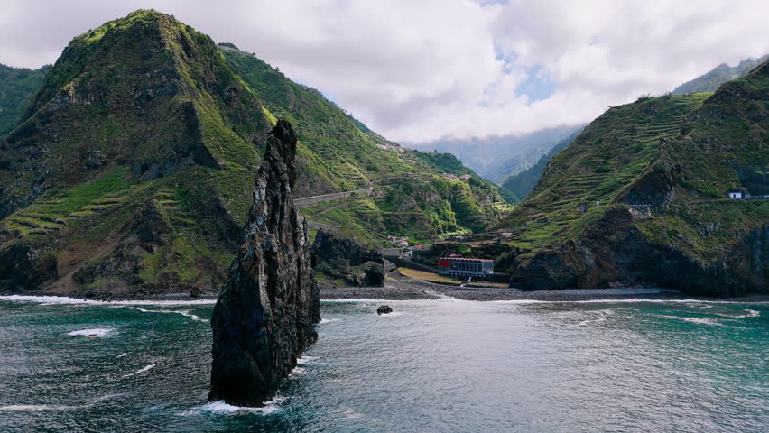 Coastal canyon landscape of Ribeira da Janela with volcanic cliffs and ocean waves, Madeira Island, Portugal