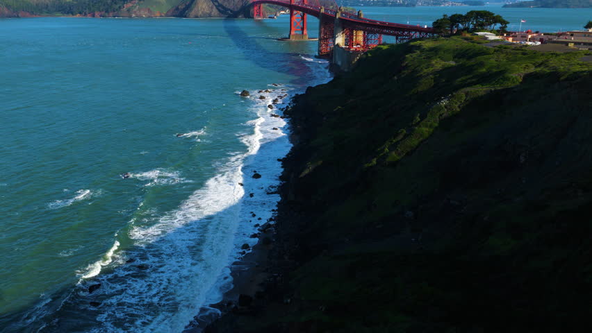 Scenic View Of Golden Gate Bridge Across Strait Connecting San Francisco Bay To Pacific Ocean In San Francisco, California. drone tilt-up shot