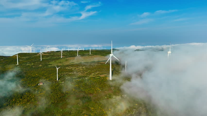 Renewable wind power in Madeira highlands, modern turbines contributing to energy independence and green transition