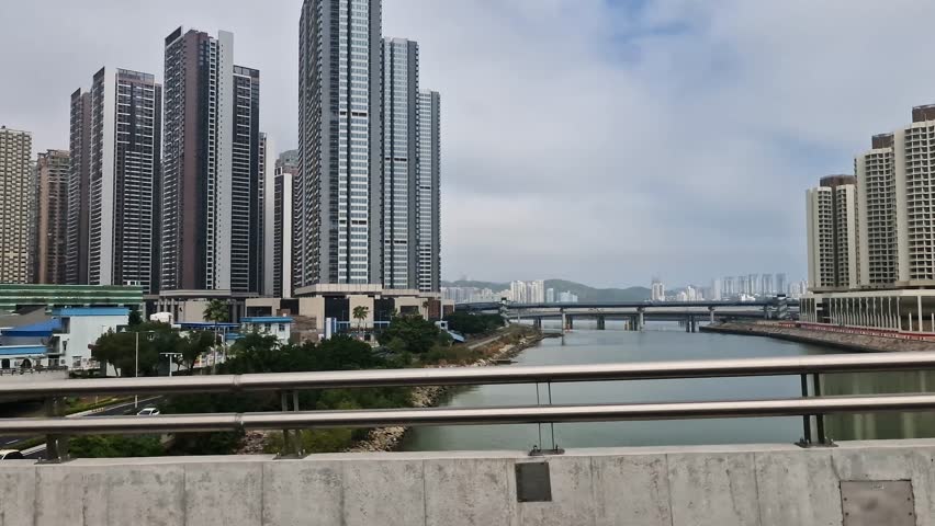 Driving on Bridge Between Macau and Mainland China, Bay and Modern Residential Towers, Passenger POV