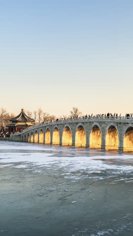 China Summer Palace Seventeen-Arch Bridge Sunset and Night Lights Time-lapse Footage