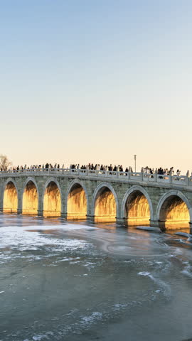 China Summer Palace Seventeen-Arch Bridge Sunset and Night Lights Time-lapse Footage