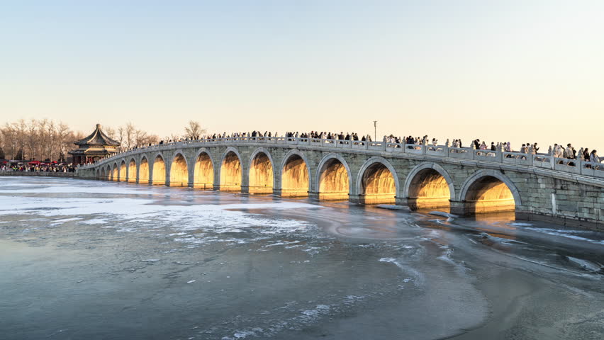 China Summer Palace Seventeen-Arch Bridge Sunset and Night Lights Time-lapse Footage